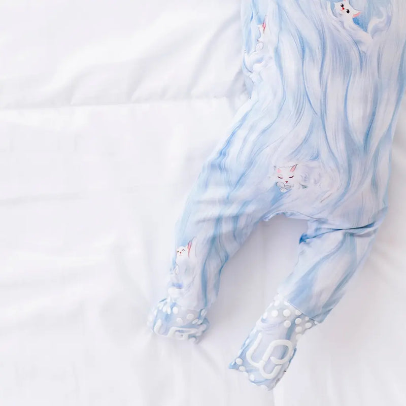 Light blue and white marbled fabric with a cat design on a white background