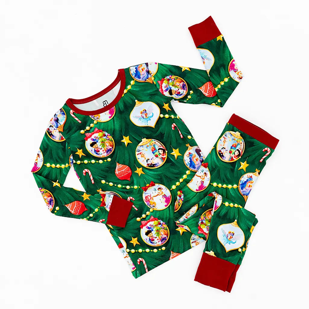 Green pajama set with Disney character ornaments on a white background