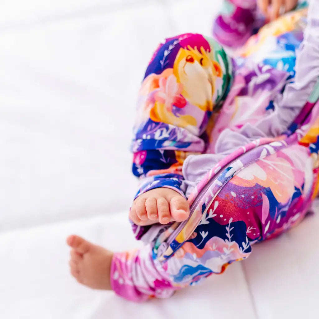 Colorful children's snowsuit with a cartoon character on a white background