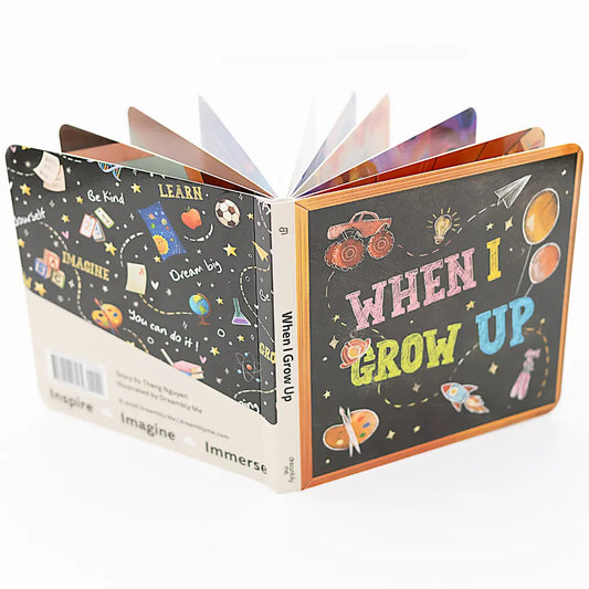 The When I Grow Up board book standing open with fanned pages, showing the chalkboard-style front and back covers.