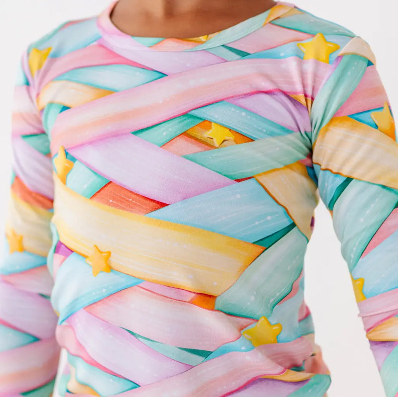 Colorful patterned shirt with pastel colors and star shapes