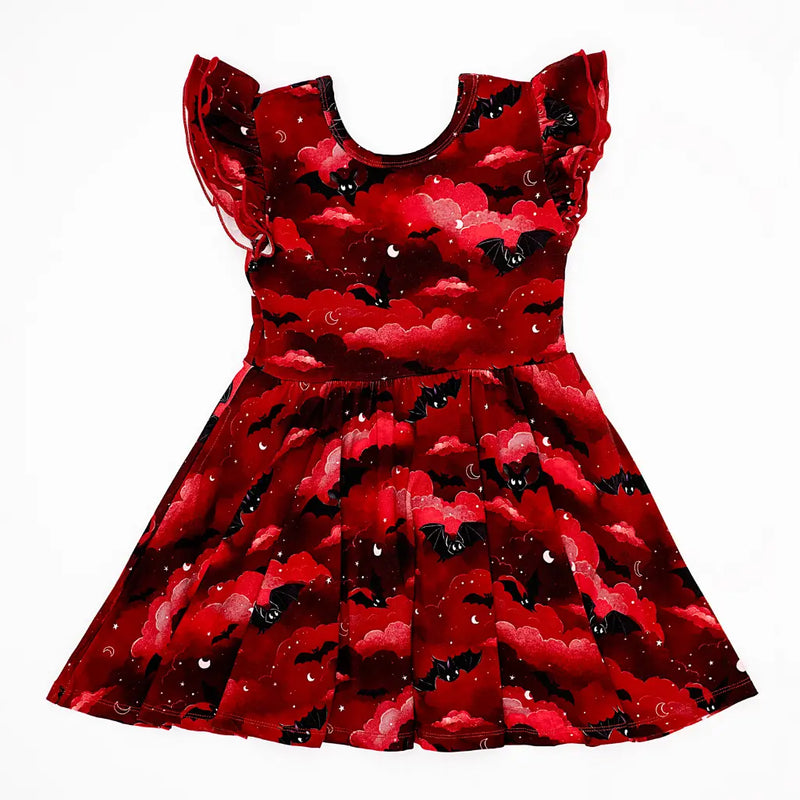 Red dress with black bat pattern on a white background