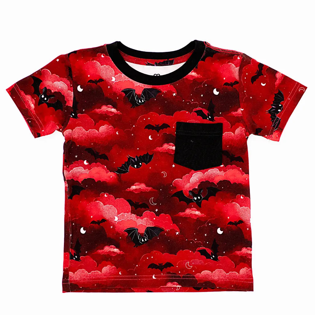 Red t-shirt with black bat pattern on a white background