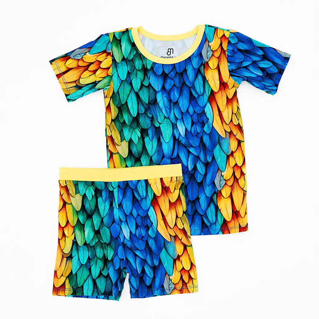 Colorful feather-patterned shirt and shorts set on a white background