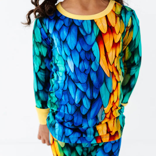 Colorful parrot-themed shirt with long sleeves on a white background