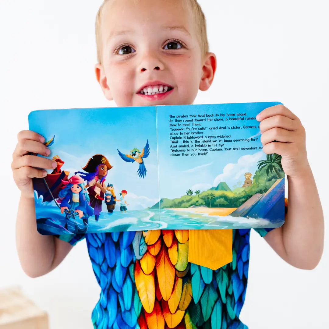 Child holding a colorful book open to a page with a tropical scene