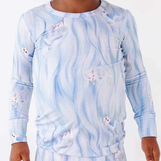 Long-sleeve shirt with a blue and white abstract pattern on a plain background