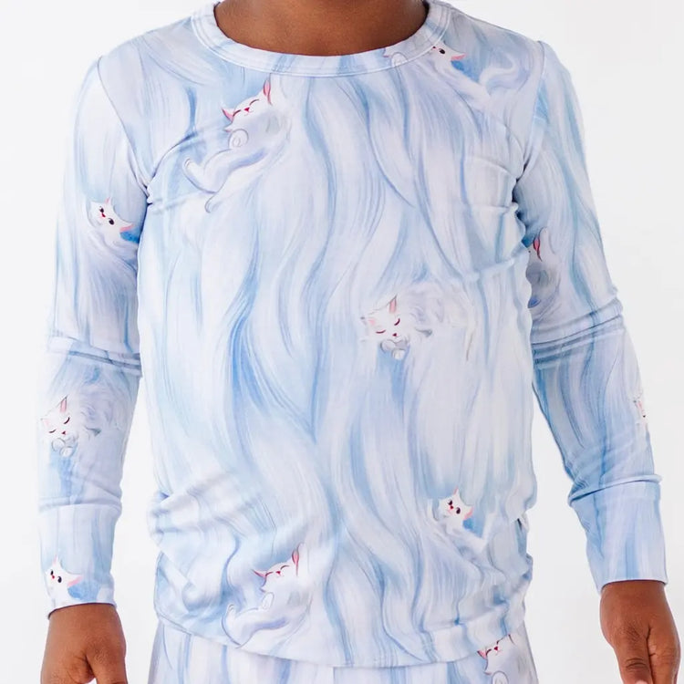 Long-sleeve shirt with a blue and white abstract pattern on a plain background