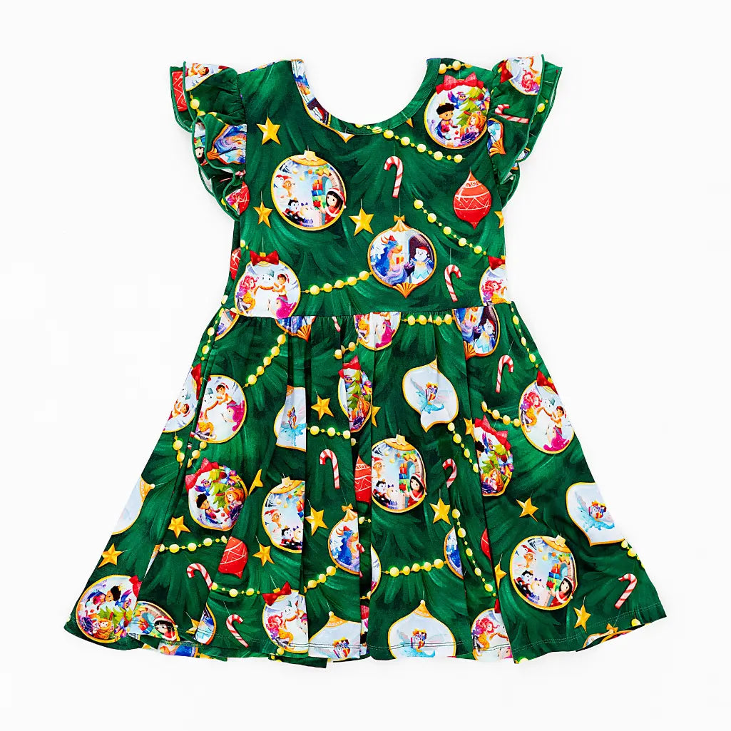 Green dress with Christmas-themed ornaments and characters on a white background