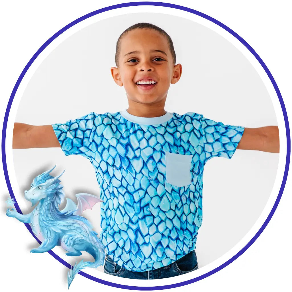 Child wearing a blue dragon-themed shirt with a small dragon graphic on a white background