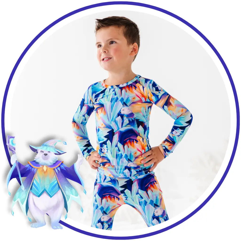 Child wearing a colorful floral outfit with a small cartoon character on a white background