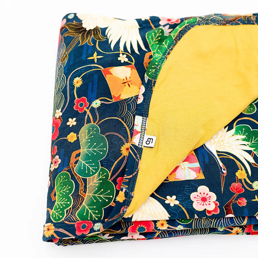 Floral-patterned fabric with a yellow corner on a white background