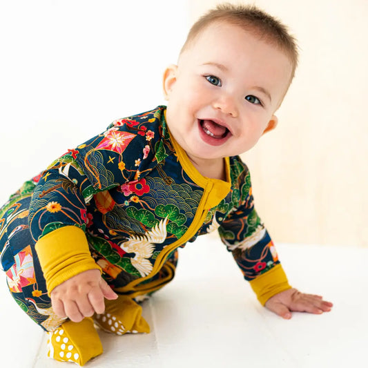 Baby wearing a colorful outfit with a white background