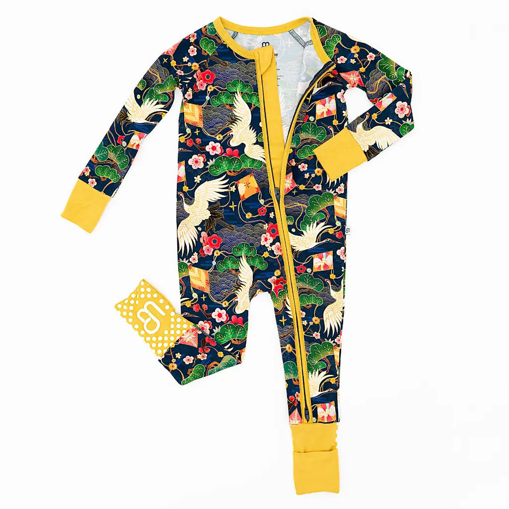 Children's onesie with a colorful pattern on a white background