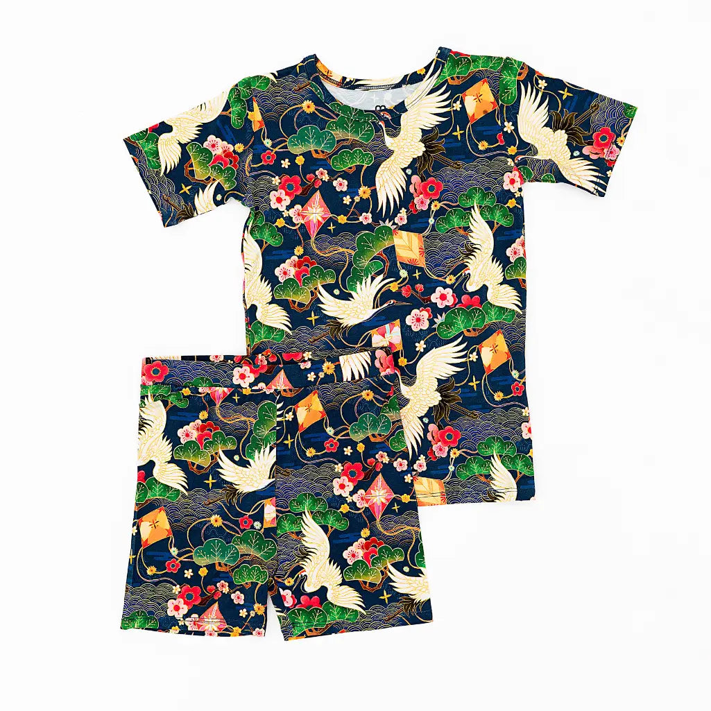 T-shirt and shorts set with a colorful pattern on a white background