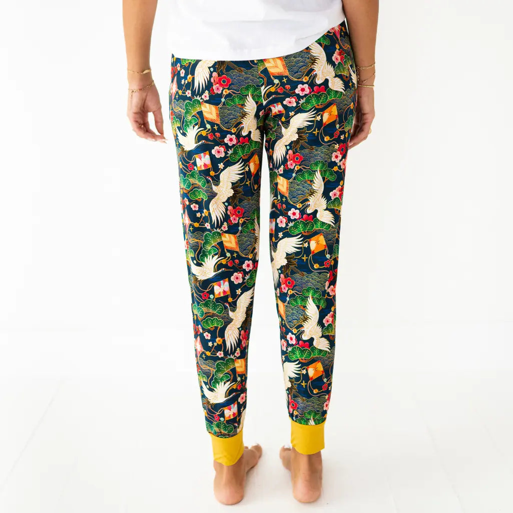 Colorful patterned pants with birds and flowers on a white background