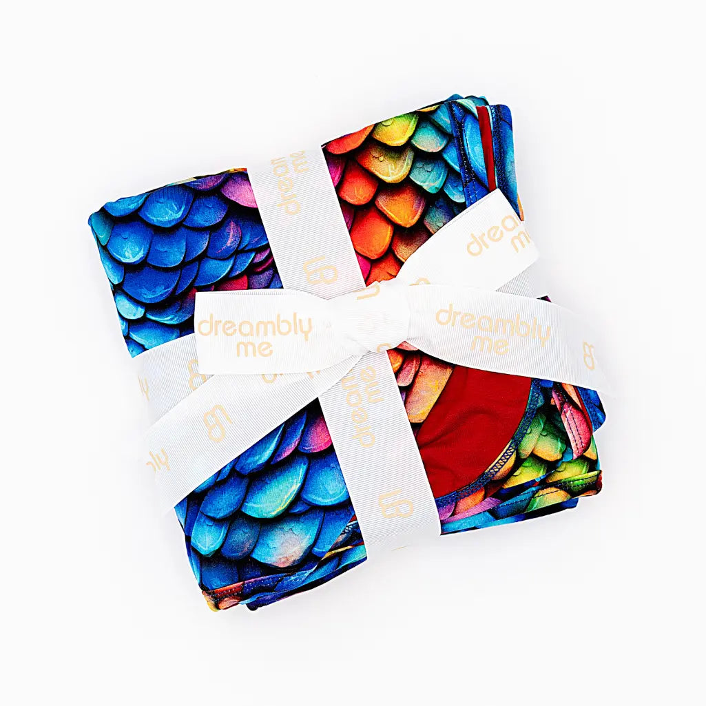 Colorful patterned fabric with a brand logo on a white background