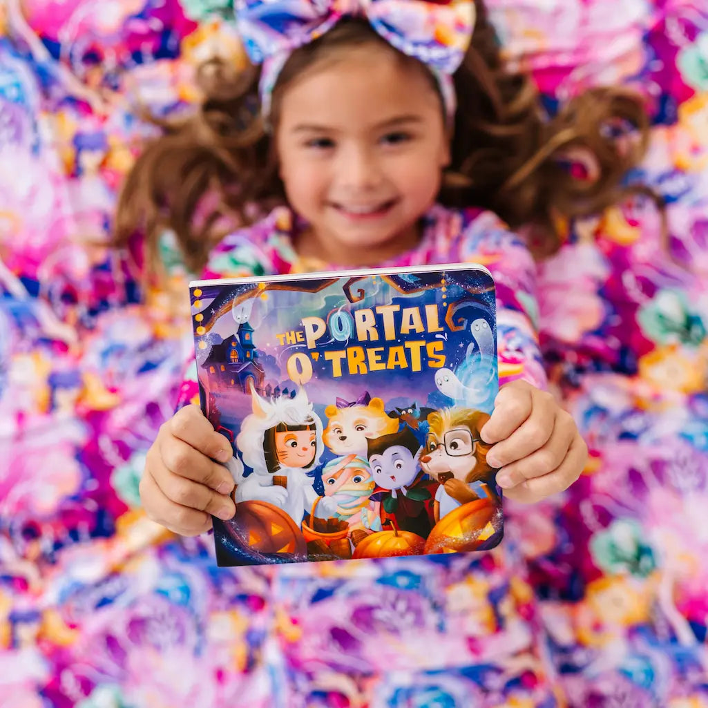 Child holding a 'Portal of Treats' candy bag against a colorful background