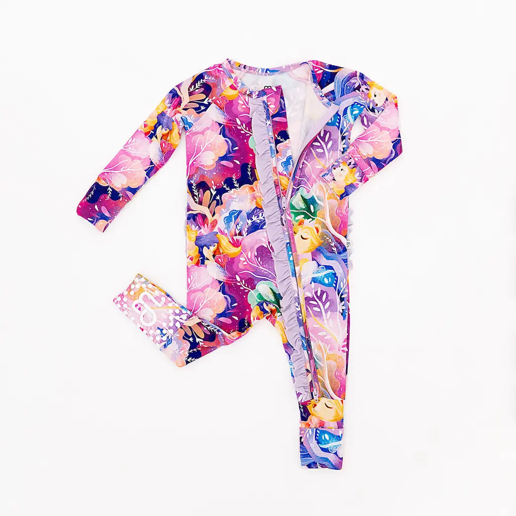 Brightly patterned floral baby romper with long sleeves displayed on a white background