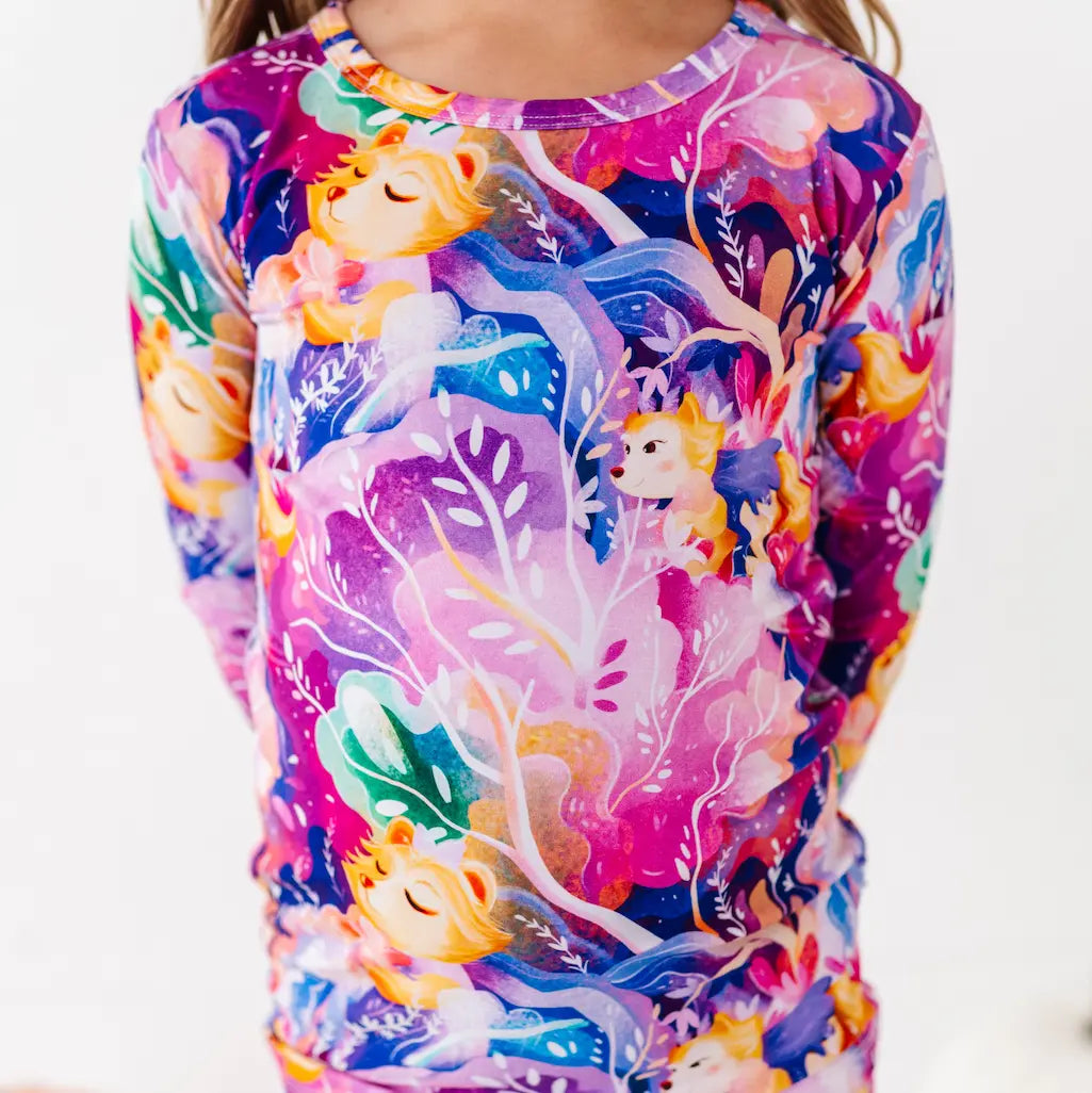 Colorful long-sleeve shirt with animal design on a white background