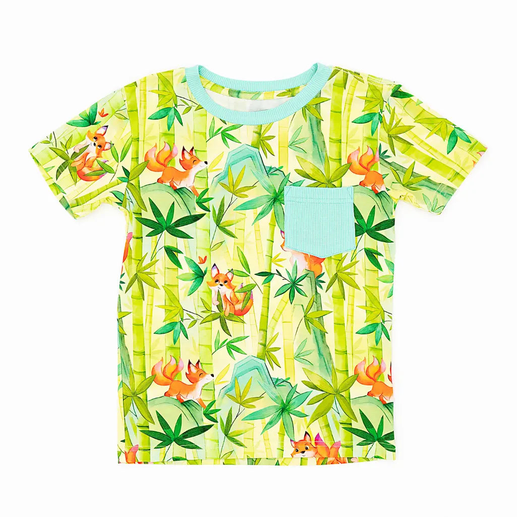 Children's t-shirt with fox and bamboo pattern on a white background