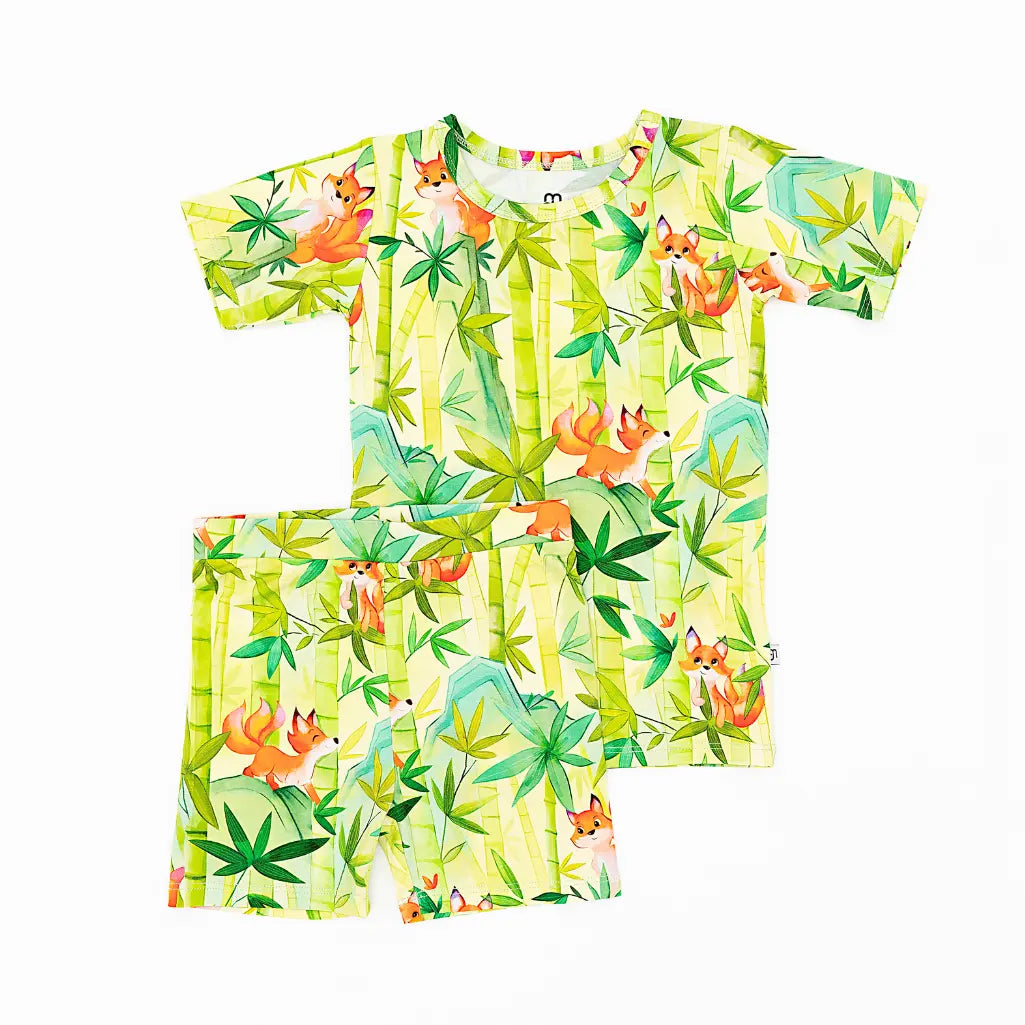 Children's t-shirt and shorts set with fox and bamboo pattern on a white background