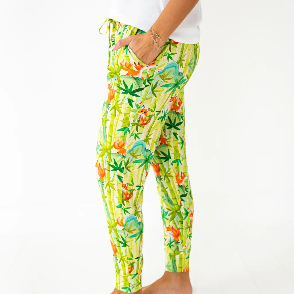 Colorful tropical print pants on a white background