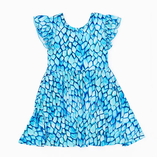 Blue patterned dress on a white background