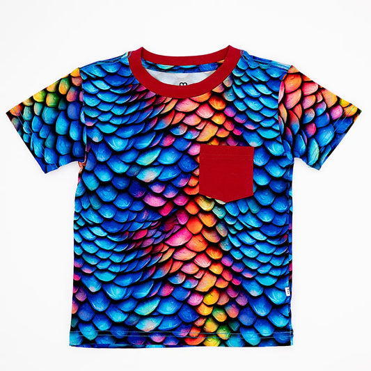 T-shirt with colorful scale pattern and red pocket on a white background