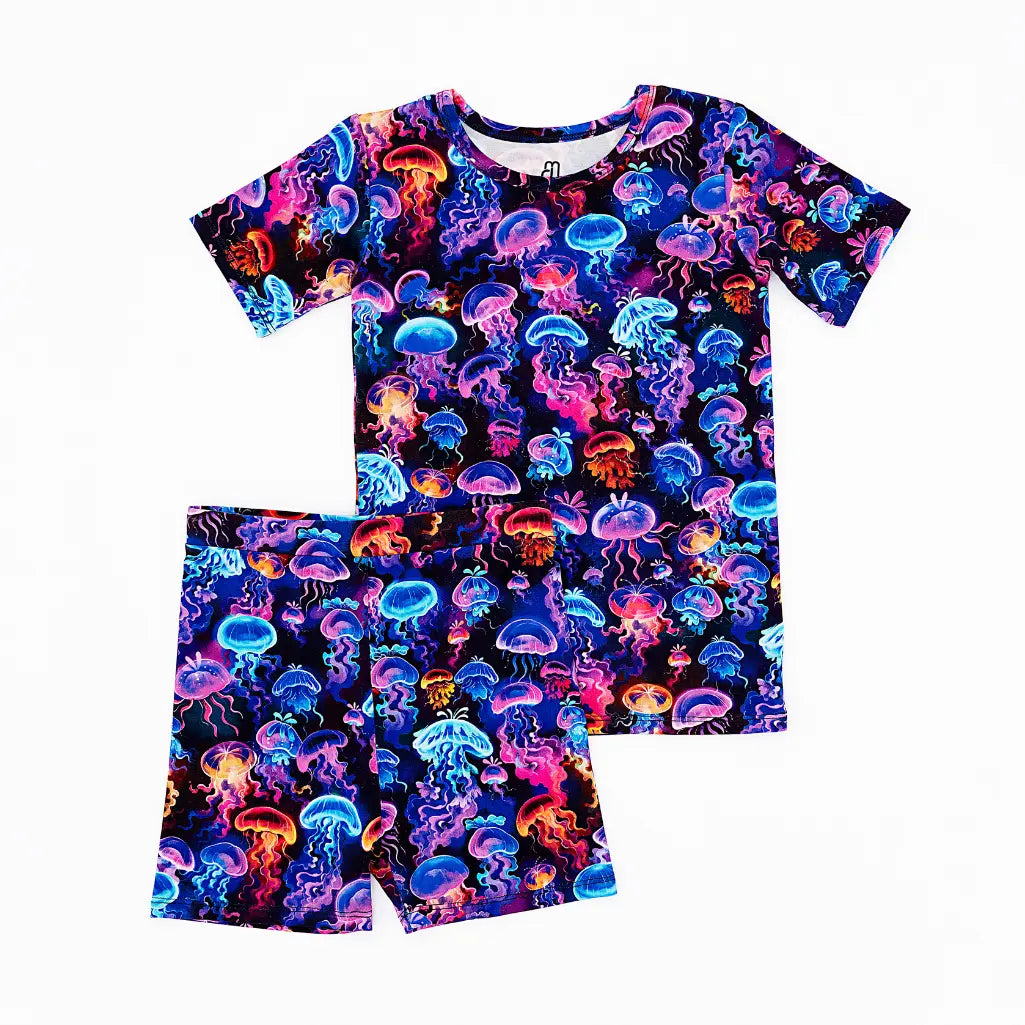 Children's pajama set with colorful jellyfish pattern on a white background