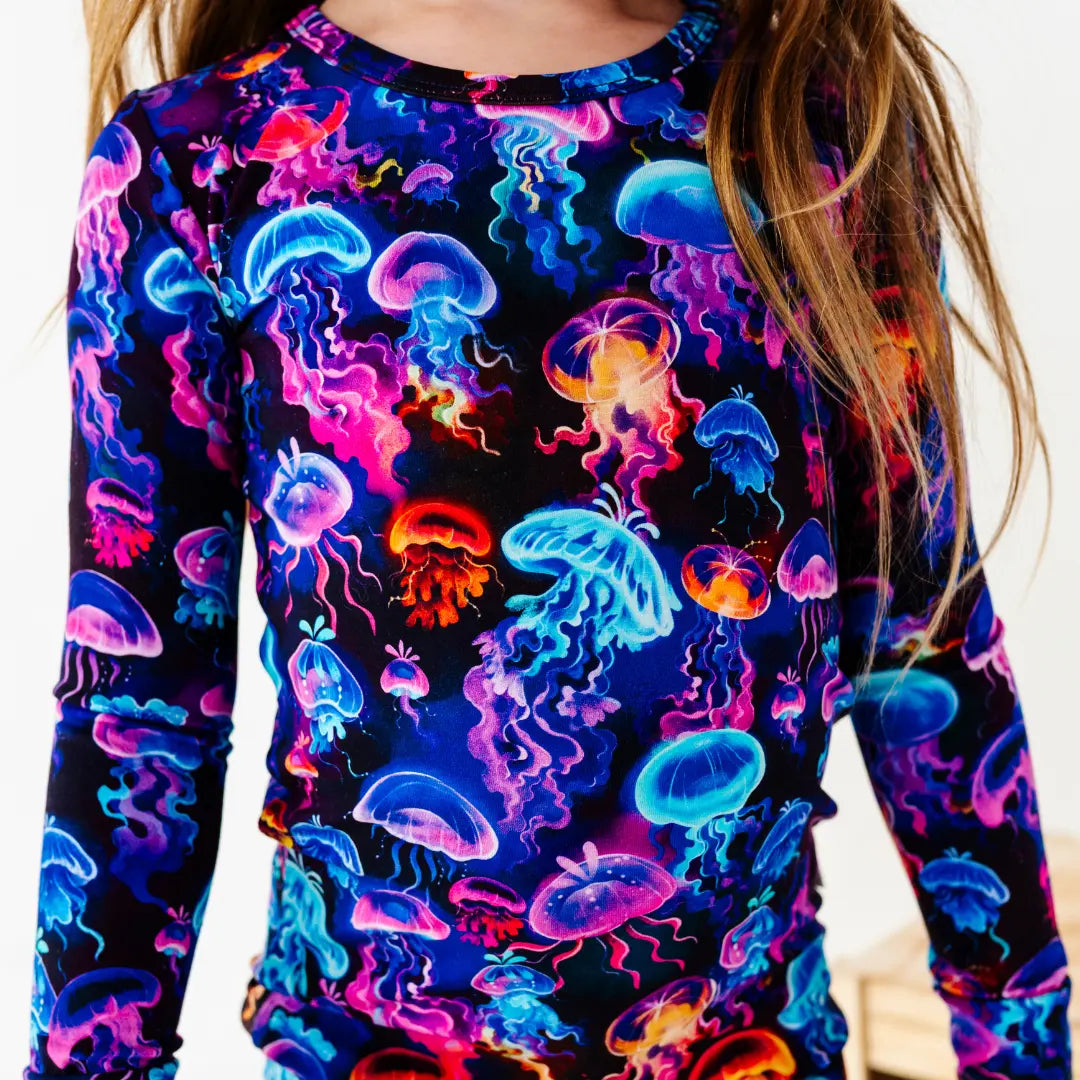 Long-sleeve shirt with colorful jellyfish pattern on a plain background