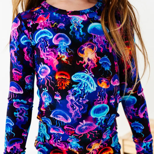 Long-sleeve shirt with colorful jellyfish pattern on a plain background