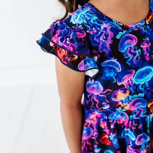 Neon jellyfish patterned dress on a white background