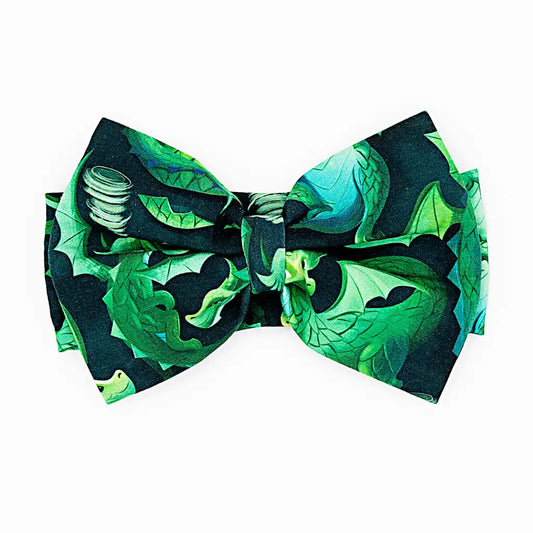 Green and black patterned bow tie on a white background