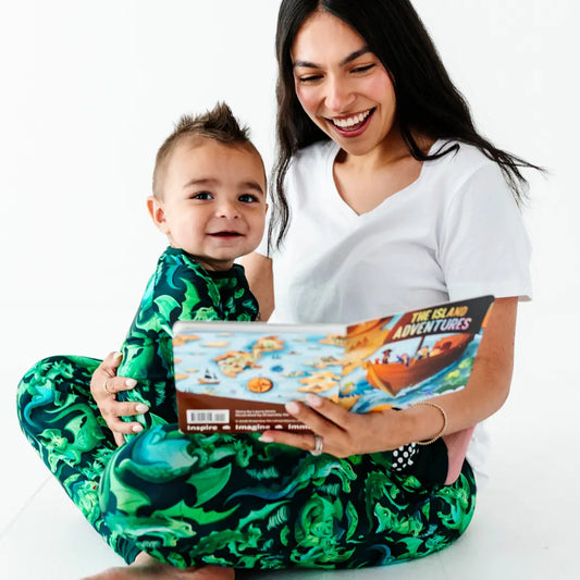 Woman and child reading a book together on a white background