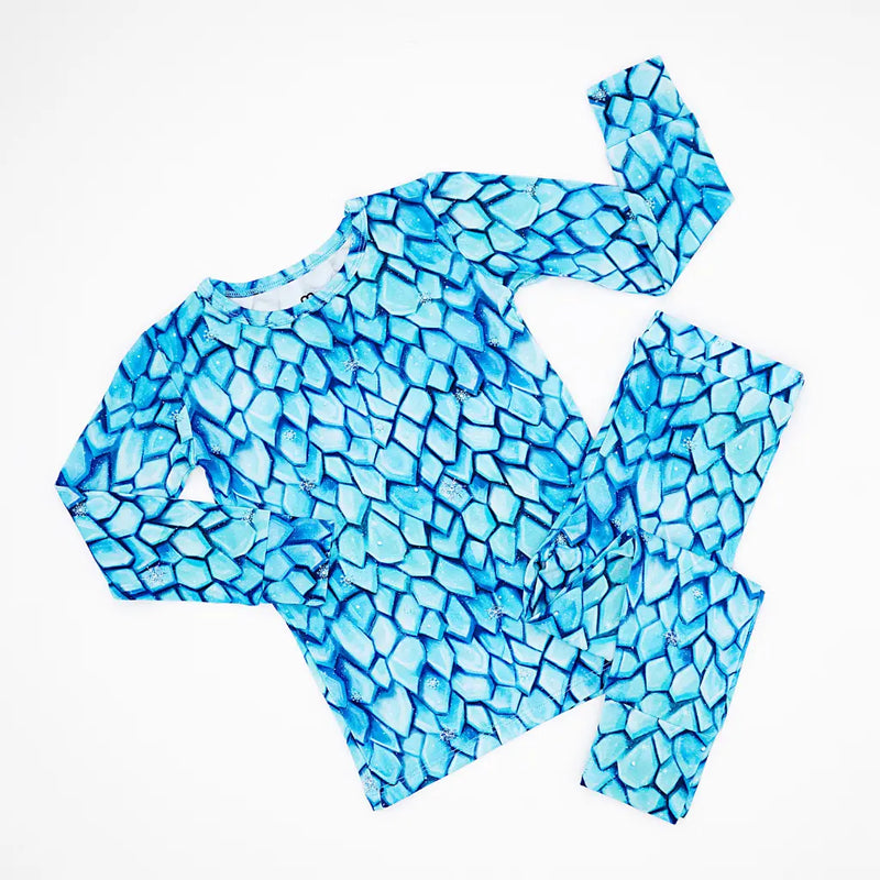 Blue mosaic-patterned outfit on a white background