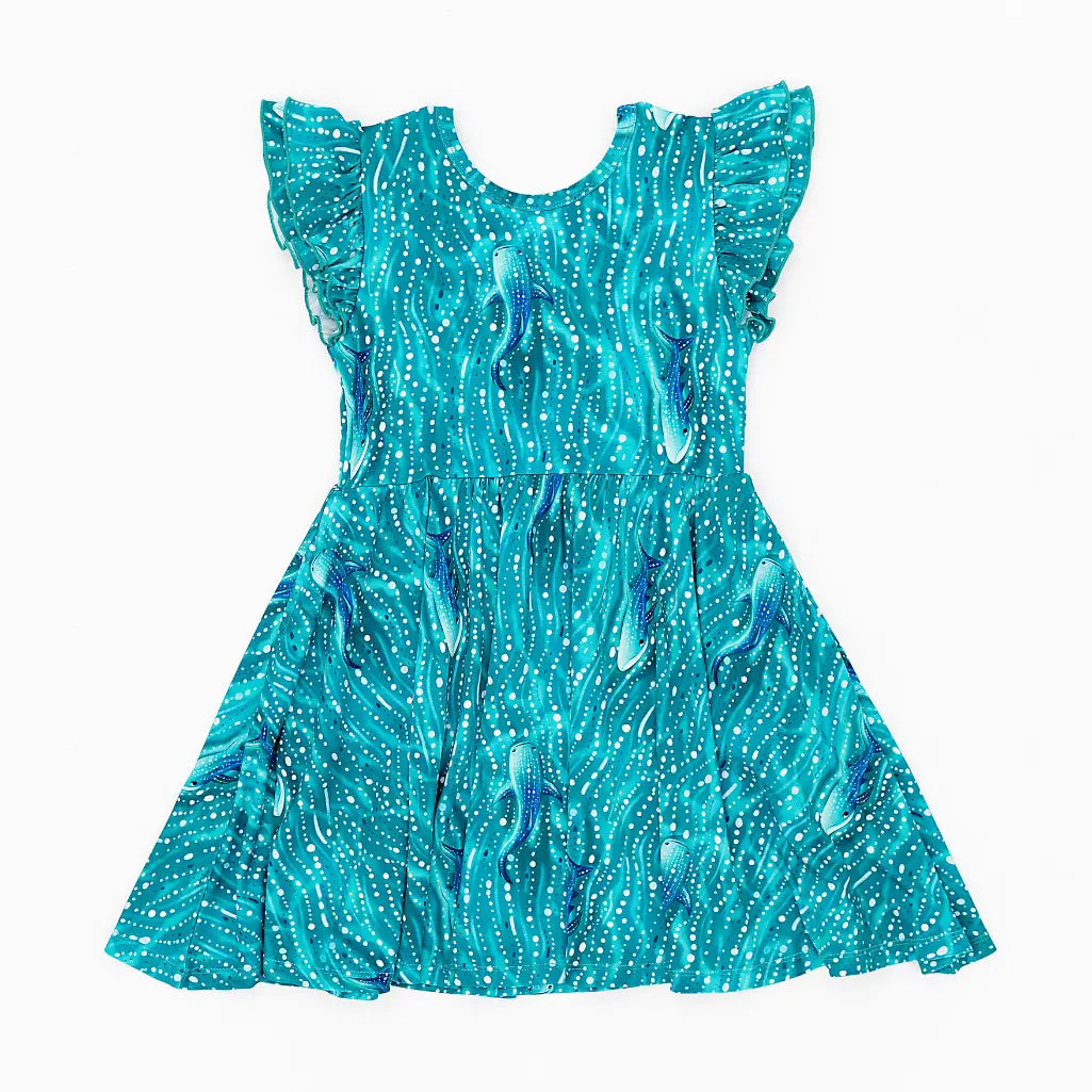 Turquoise dress with a pattern on a white background