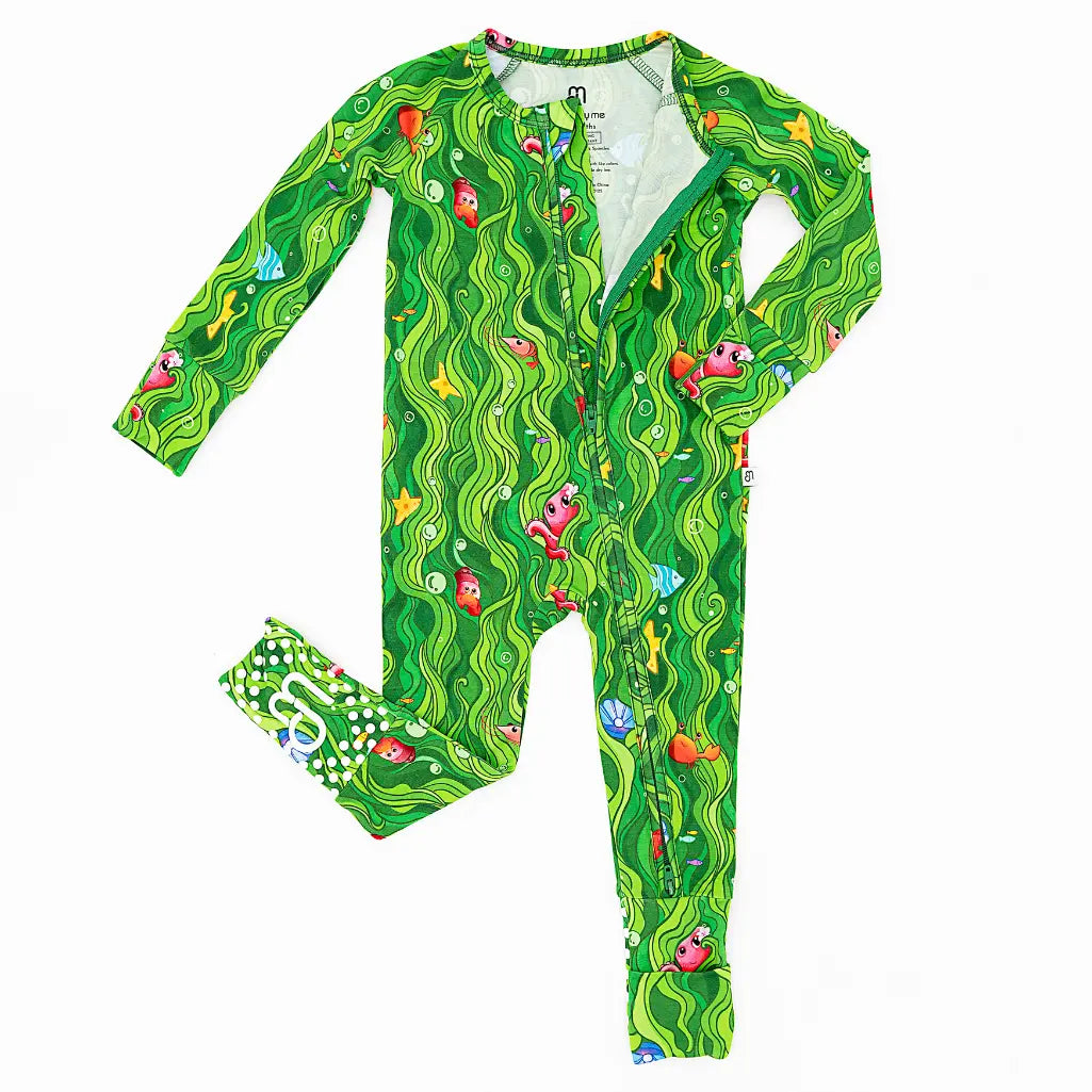 Green children's onesie with colorful fish pattern on a white background