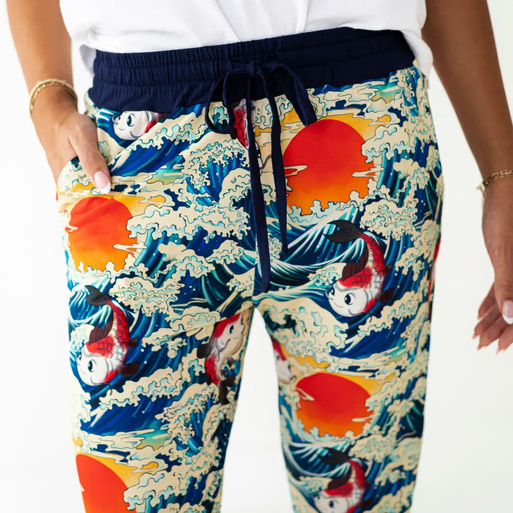 Colorful pants with wave and fish design on a white background