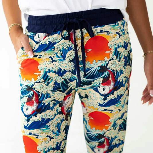 Colorful pants with wave and fish design on a white background