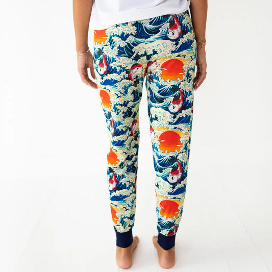 Colorful patterned pants with a design of waves and suns on a white background