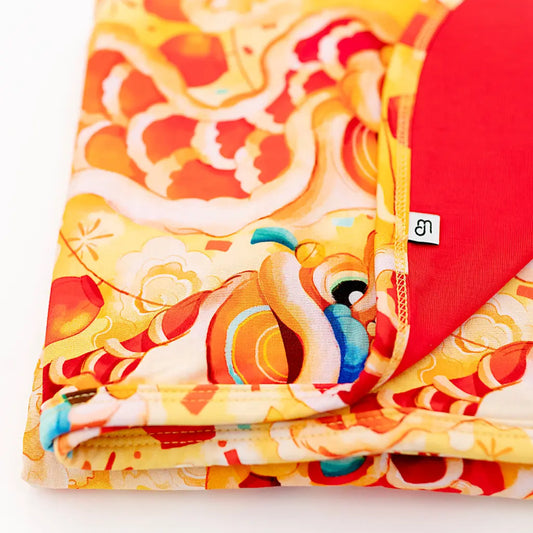 Colorful fabric with dragon design on a white background