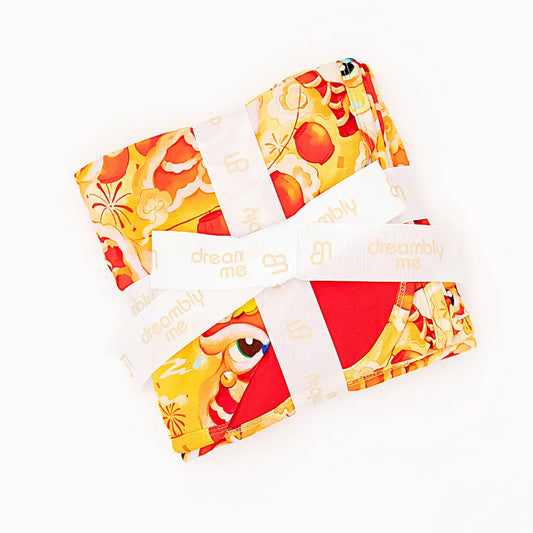Colorful fabric swatches with cartoon character designs on a white background