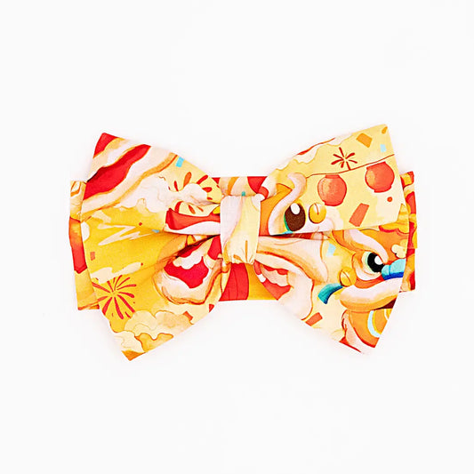 Colorful bow tie with cartoon character design on a white background