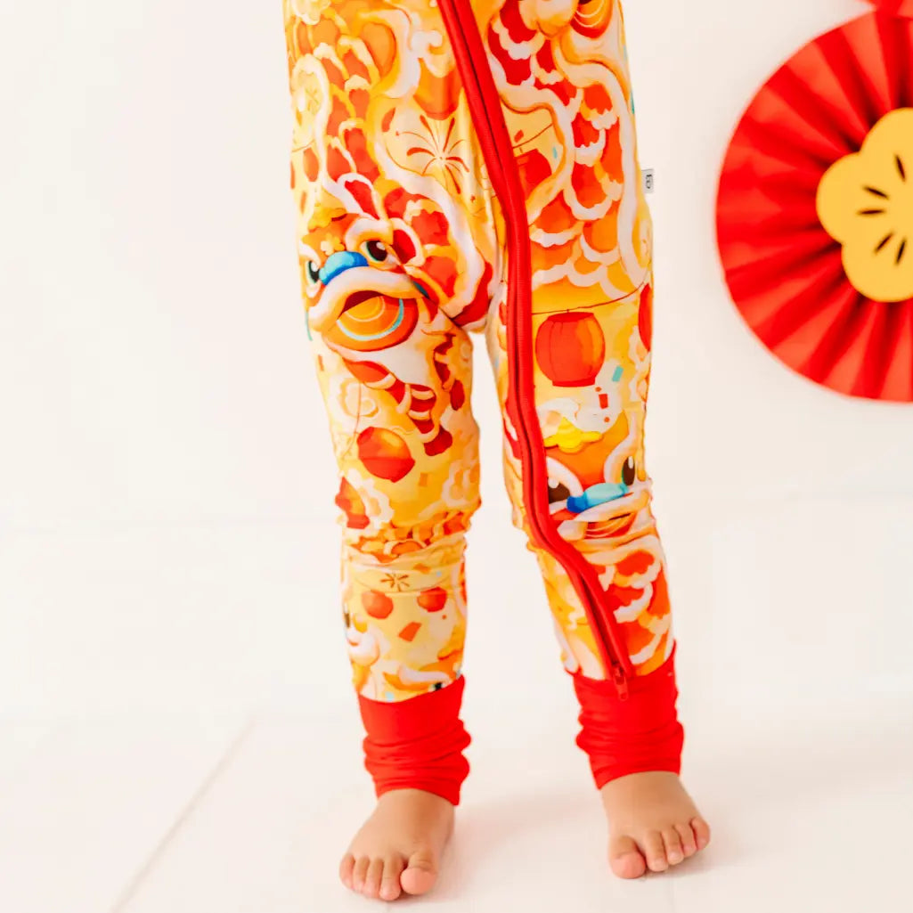 Colorful children's pajama set with dragon design on a white background