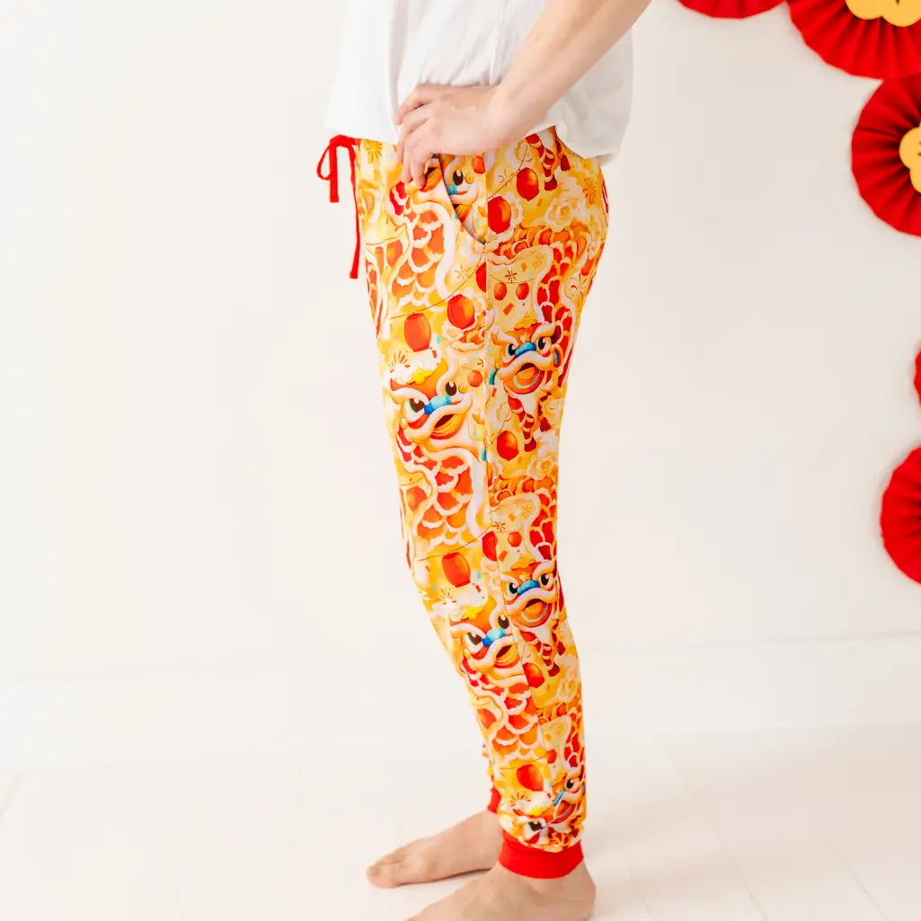Colorful pajama pants with a cartoon pattern on a white background