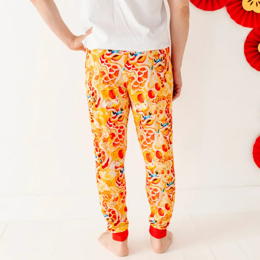 Person wearing colorful pizza-themed leggings on a white background