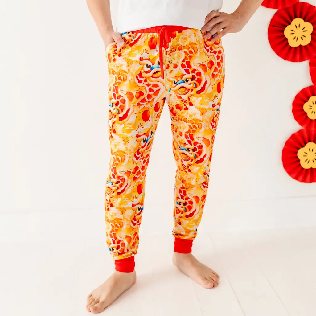 Colorful pajama pants with cartoon character design on a white background