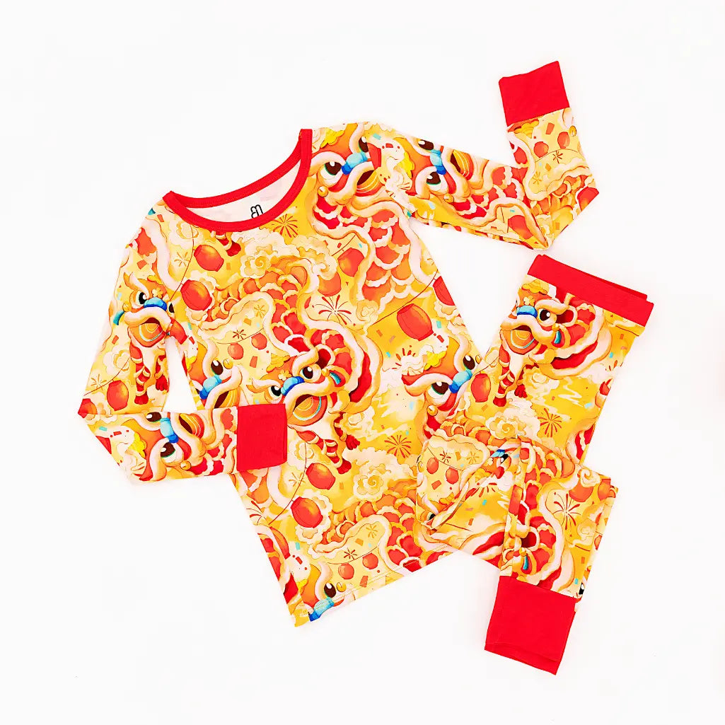Colorful pajama set with pizza design on a white background