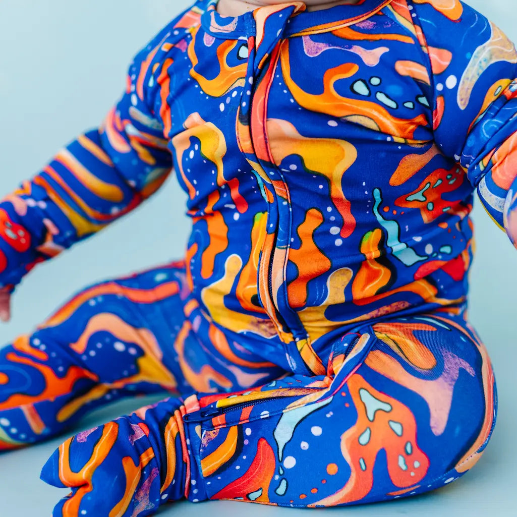 Colorful abstract-patterned outfit on a light blue background